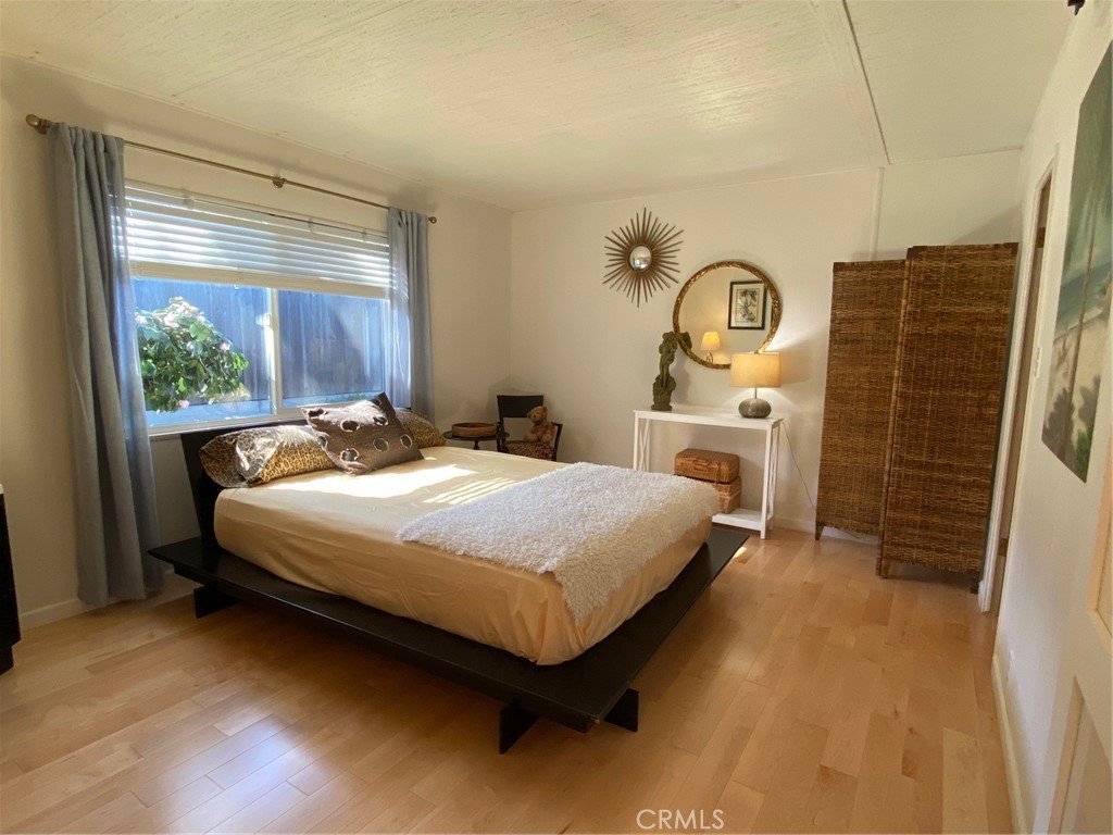 1595 Los Osos Valley Road, Unit 8A Los Osos, CA 93402 - Photo 12 of 73 a bedroom with a bed dresser and a window