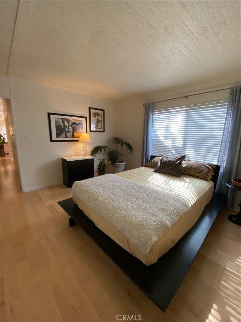 1595 Los Osos Valley Road, Unit 8A Los Osos, CA 93402 - Photo 14 of 73 a bed sitting in a bedroom next to a window