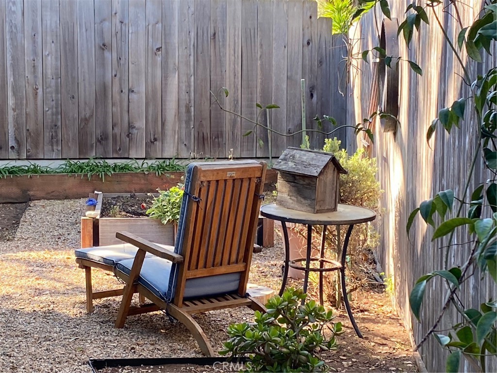 1595 Los Osos Valley Road, Unit 8A Los Osos, CA 93402 - Photo 23 of 73 a view of a chairs and table in the patio