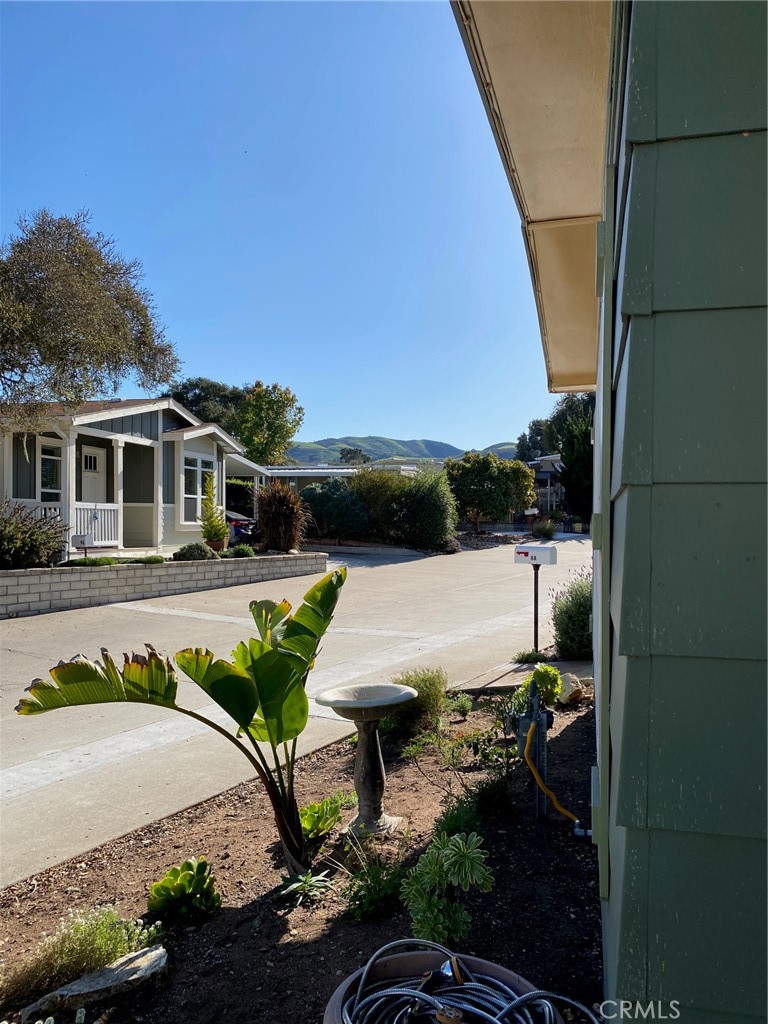 1595 Los Osos Valley Road, Unit 8A Los Osos, CA 93402 - Photo 29 of 73 a view of a swimming pool with a lounge chairs