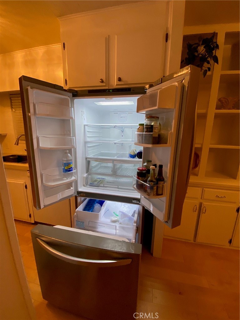 1595 Los Osos Valley Road, Unit 8A Los Osos, CA 93402 - Photo 36 of 73 a view of walk in closet with clothes and shoes