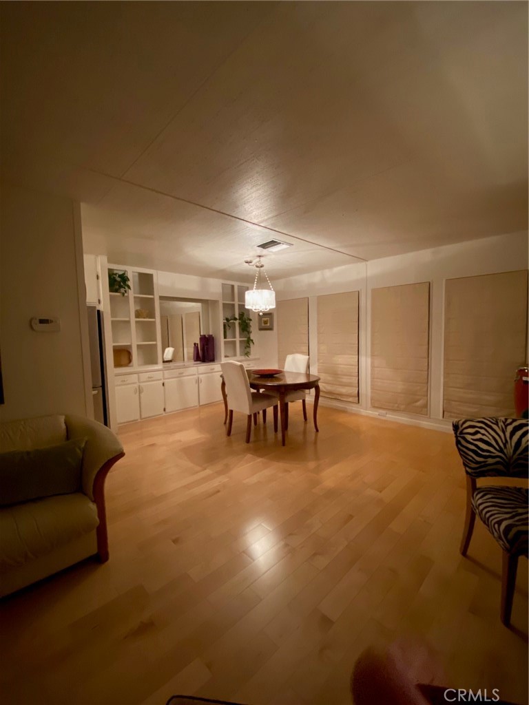 1595 Los Osos Valley Road, Unit 8A Los Osos, CA 93402 - Photo 37 of 73 a living room with furniture and a dining table with fireplace