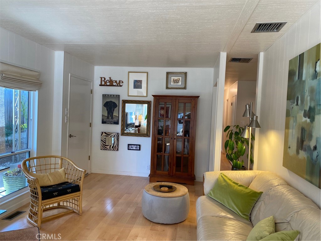 1595 Los Osos Valley Road, Unit 8A Los Osos, CA 93402 - Photo 4 of 73 a living room with furniture and a potted plant