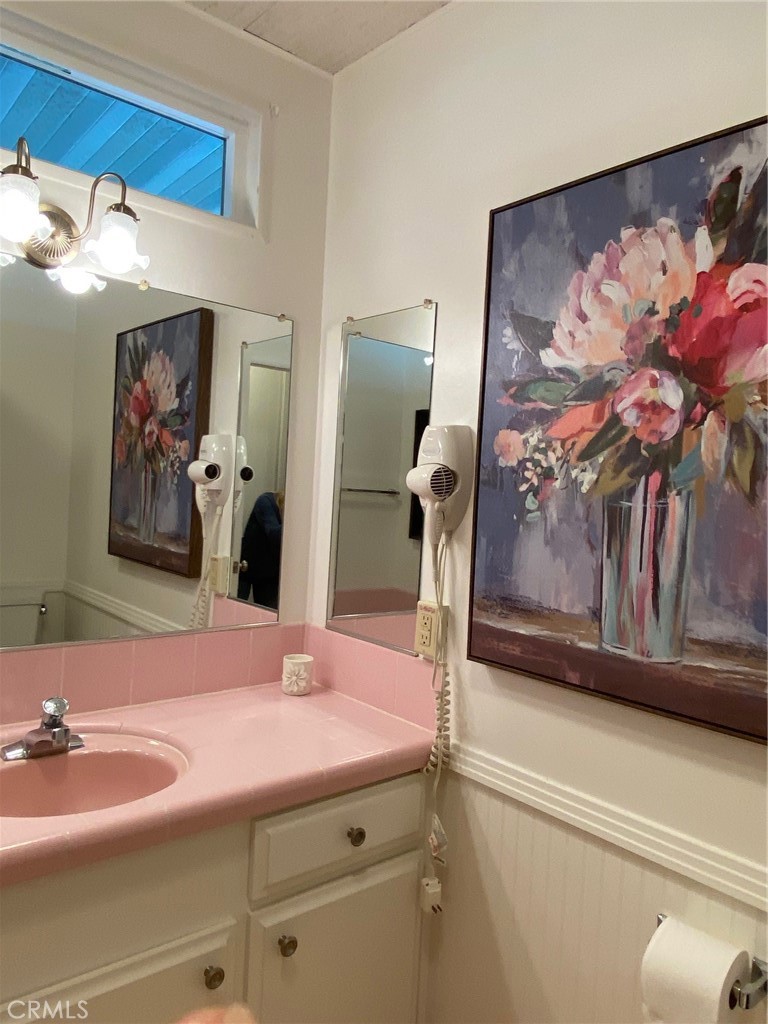 1595 Los Osos Valley Road, Unit 8A Los Osos, CA 93402 - Photo 41 of 73 a bathroom with a sink and mirror with painted walls