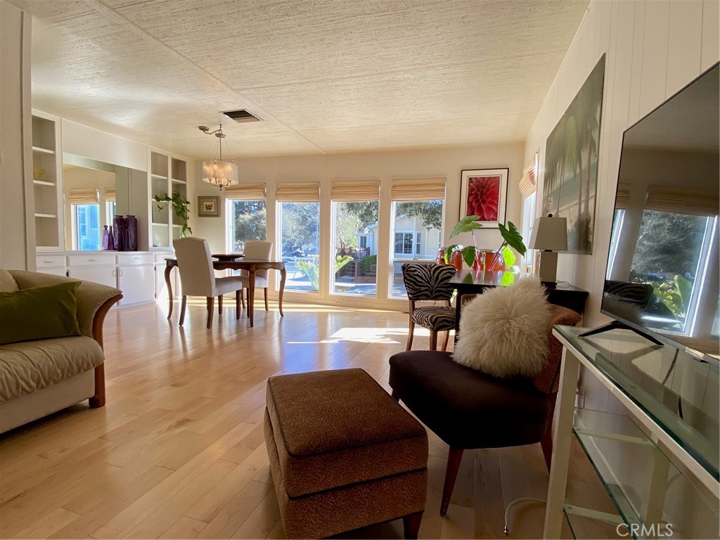 1595 Los Osos Valley Road, Unit 8A Los Osos, CA 93402 - Photo 50 of 73 a living room with furniture and a flat screen tv