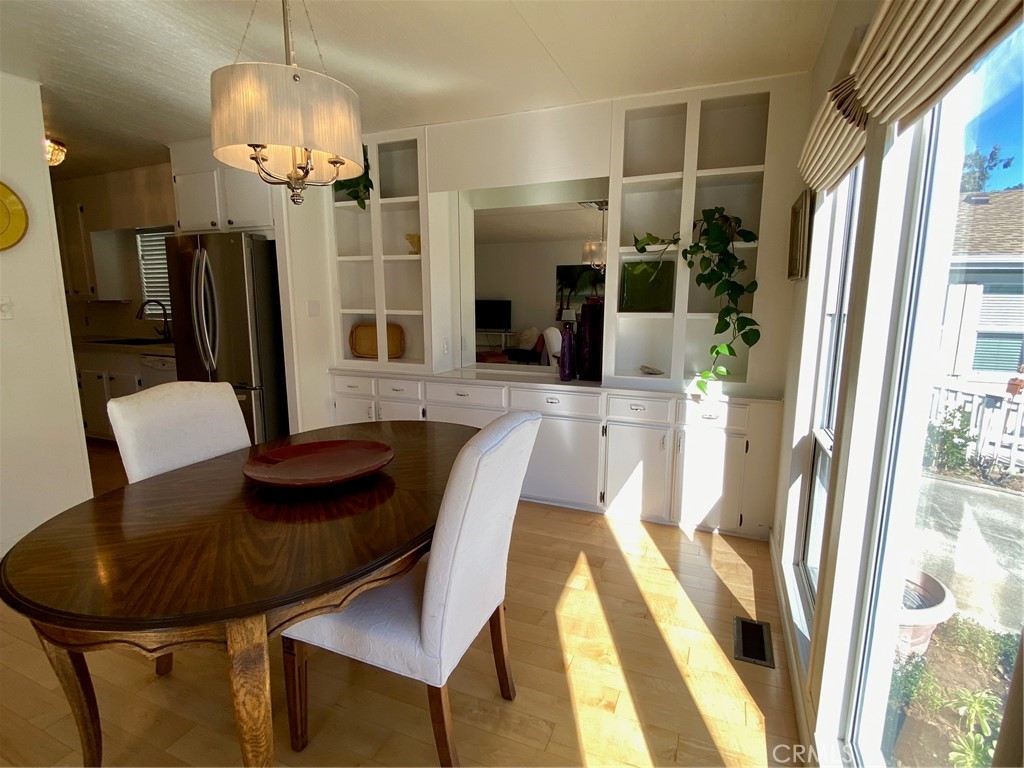 1595 Los Osos Valley Road, Unit 8A Los Osos, CA 93402 - Photo 6 of 73 a view of a dining room with furniture and a chandelier