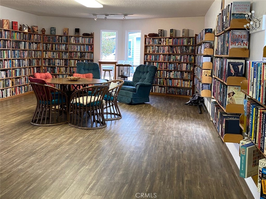 1595 Los Osos Valley Road, Unit 8A Los Osos, CA 93402 - Photo 64 of 73 a view of a workspace with furniture and wooden floor