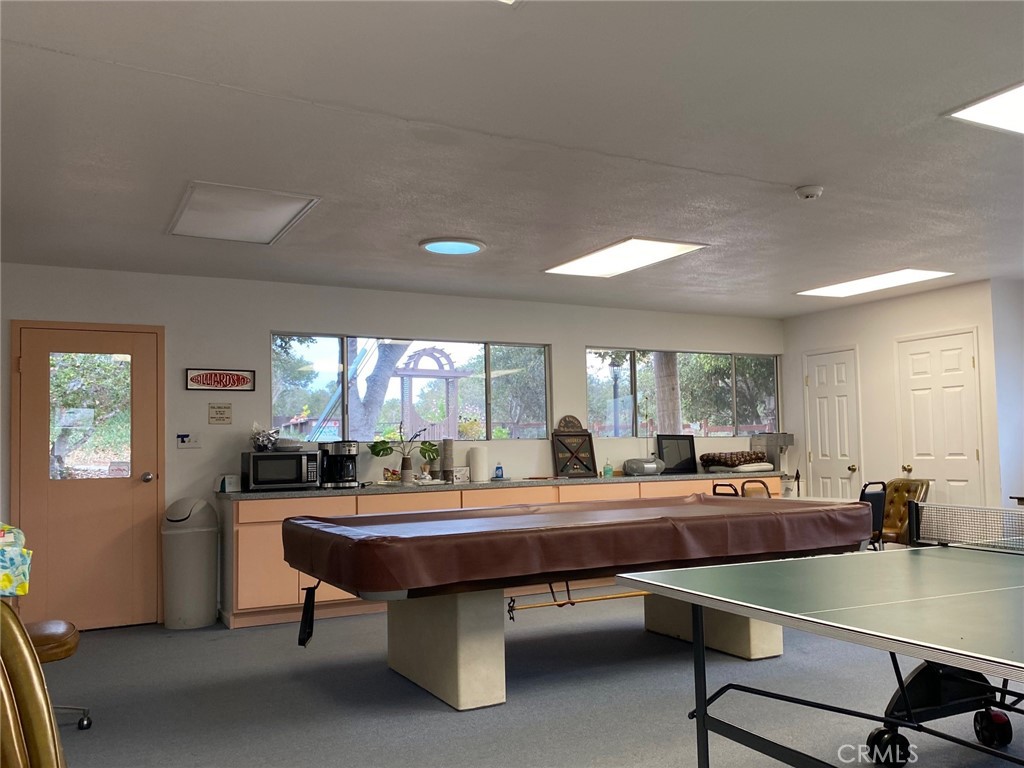 1595 Los Osos Valley Road, Unit 8A Los Osos, CA 93402 - Photo 65 of 73 a room with dining table and chairs
