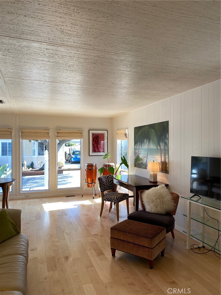 1595 Los Osos Valley Road, Unit 8A Los Osos, CA 93402 - Photo 68 of 73 a living room with furniture and a flat screen tv