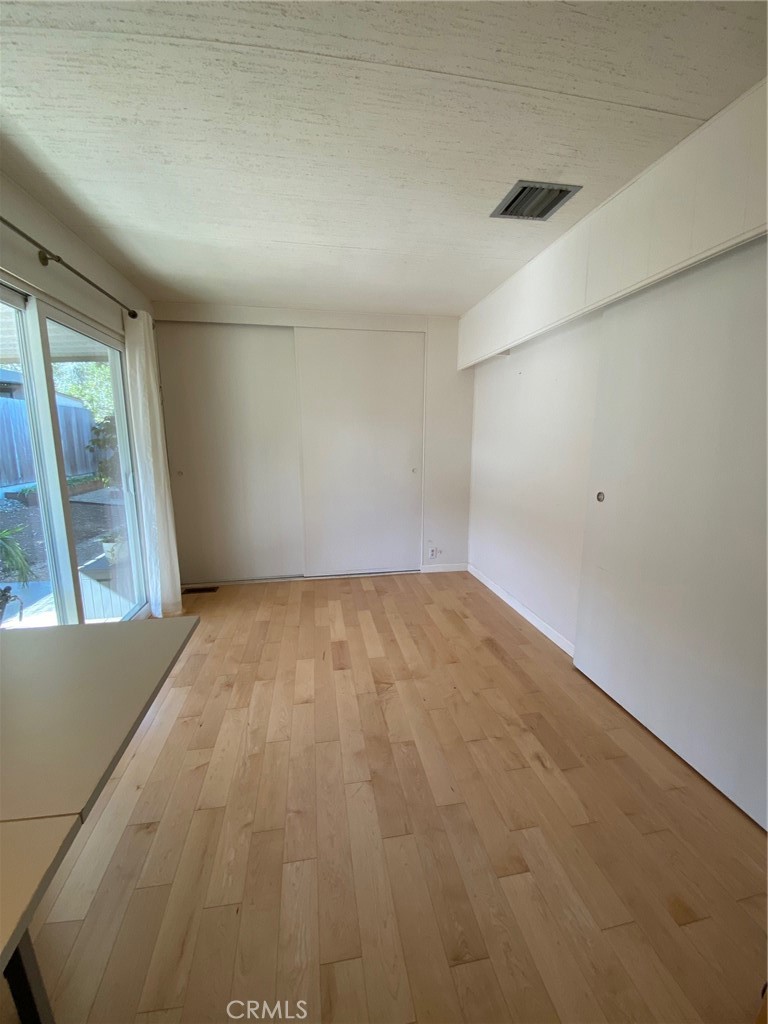 1595 Los Osos Valley Road, Unit 8A Los Osos, CA 93402 - Photo 73 of 73 an empty room with a fireplace