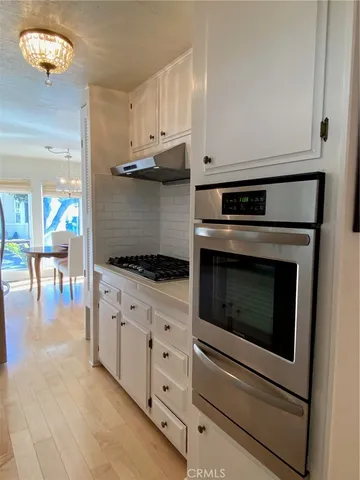 a bedroom with a bed dresser and a window