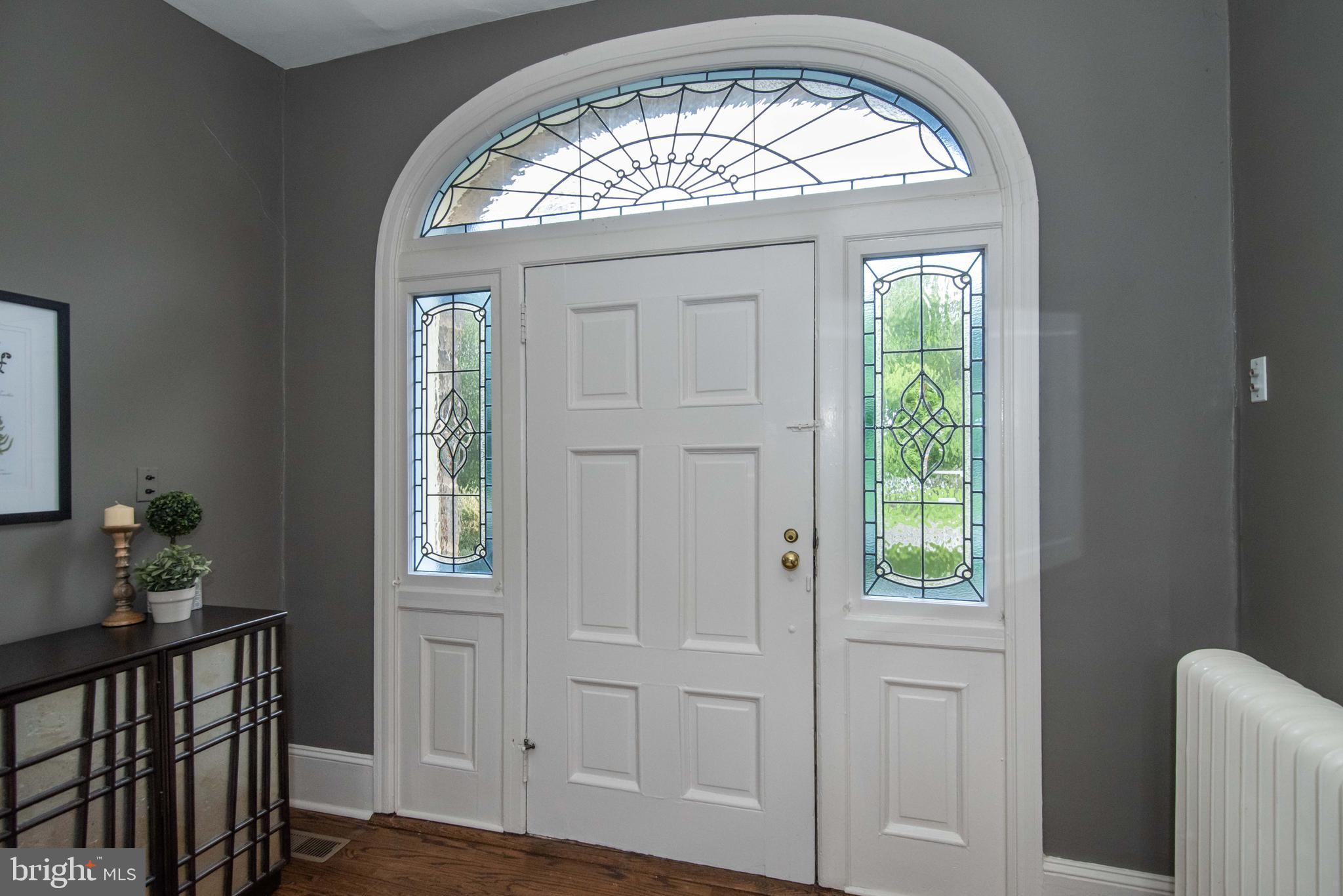 559 Red Fox Lane Wayne, PA 19087 - Photo 6 of 57 Stained glass surrounds entry door