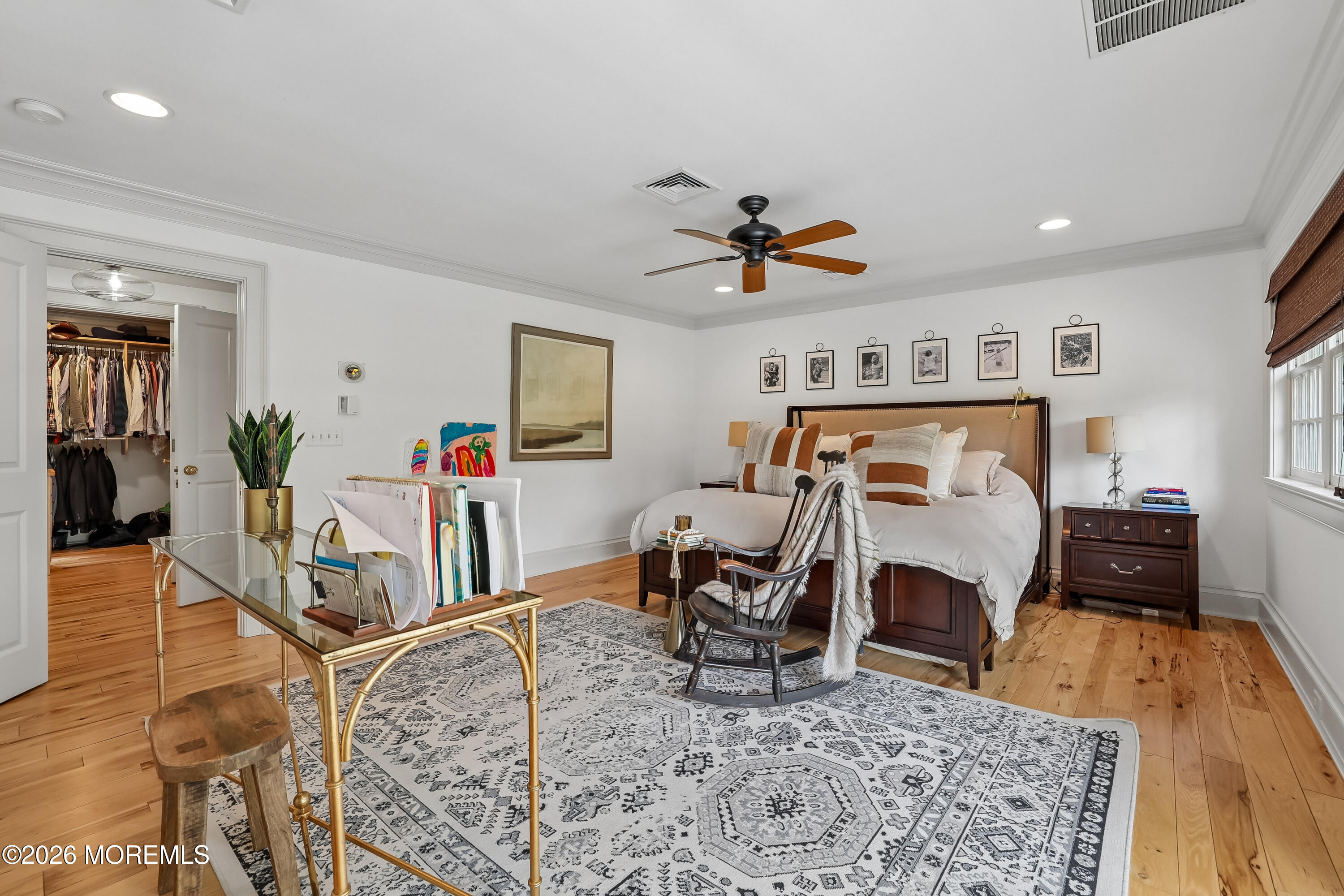 92 Tulip Lane Colts Neck, NJ 07722 - Photo 22 of 55 a bedroom with furniture and a wooden floor