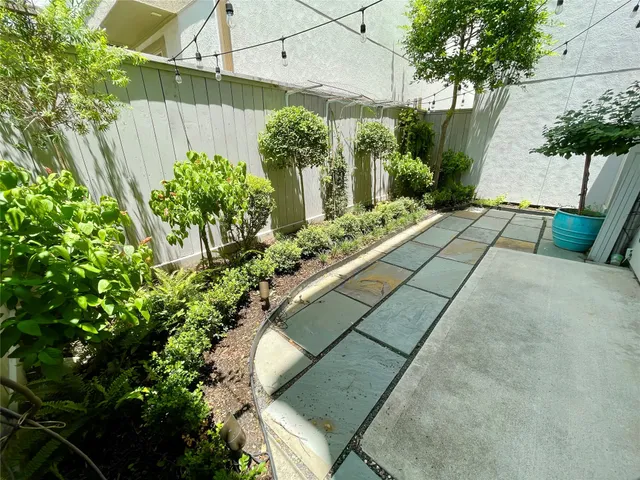 a view of a swimming pool with outdoor seating