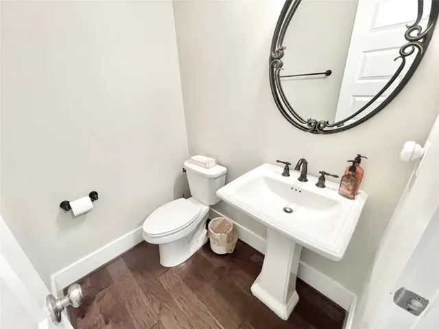 a bathroom with a sink a mirror and shower