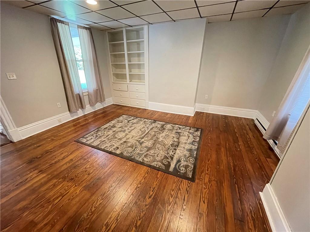 361 Searight Herbert Road Uniontown, PA 15401 - Photo 2 of 14 a view of an empty room with wooden floor and a window