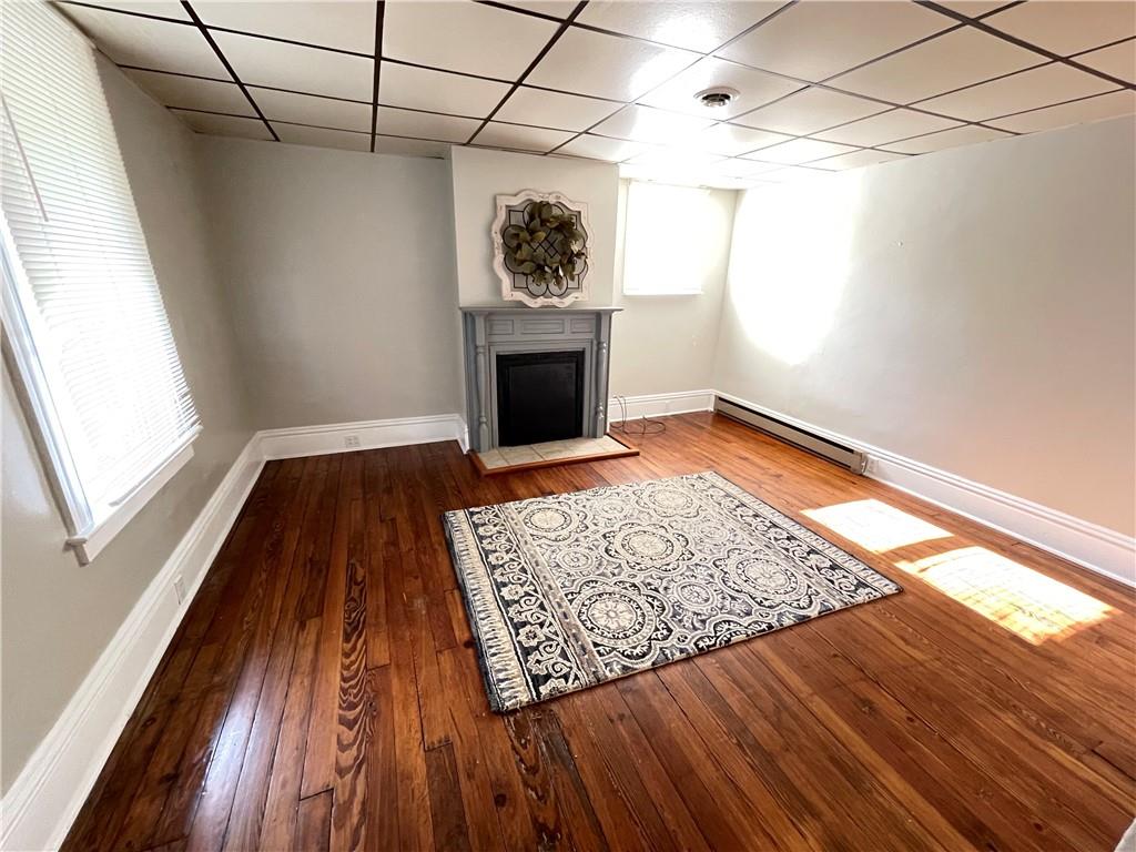 361 Searight Herbert Road Uniontown, PA 15401 - Photo 3 of 14 a view of a livingroom with wooden floor and a fireplace