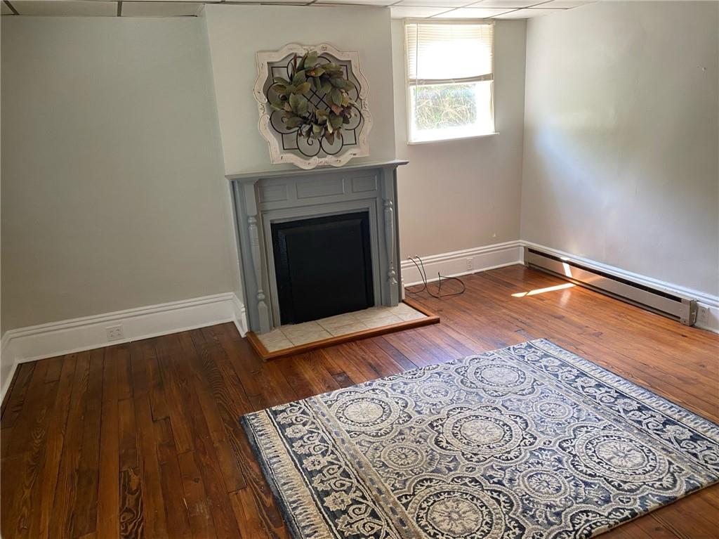 361 Searight Herbert Road Uniontown, PA 15401 - Photo 4 of 14 a view of a room with wooden floor and a fireplace
