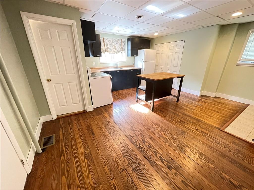 361 Searight Herbert Road Uniontown, PA 15401 - Photo 5 of 14 a view of a kitchen with dining room and wooden floor