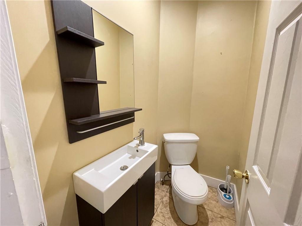 361 Searight Herbert Road Uniontown, PA 15401 - Photo 7 of 14 a bathroom with a toilet and a sink