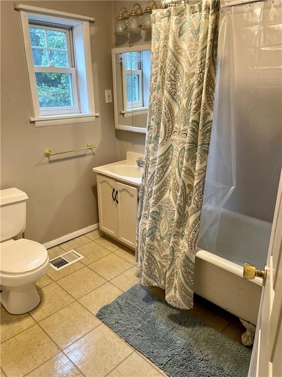 361 Searight Herbert Road Uniontown, PA 15401 - Photo 9 of 14 a bathroom with a sink a toilet a window and shower