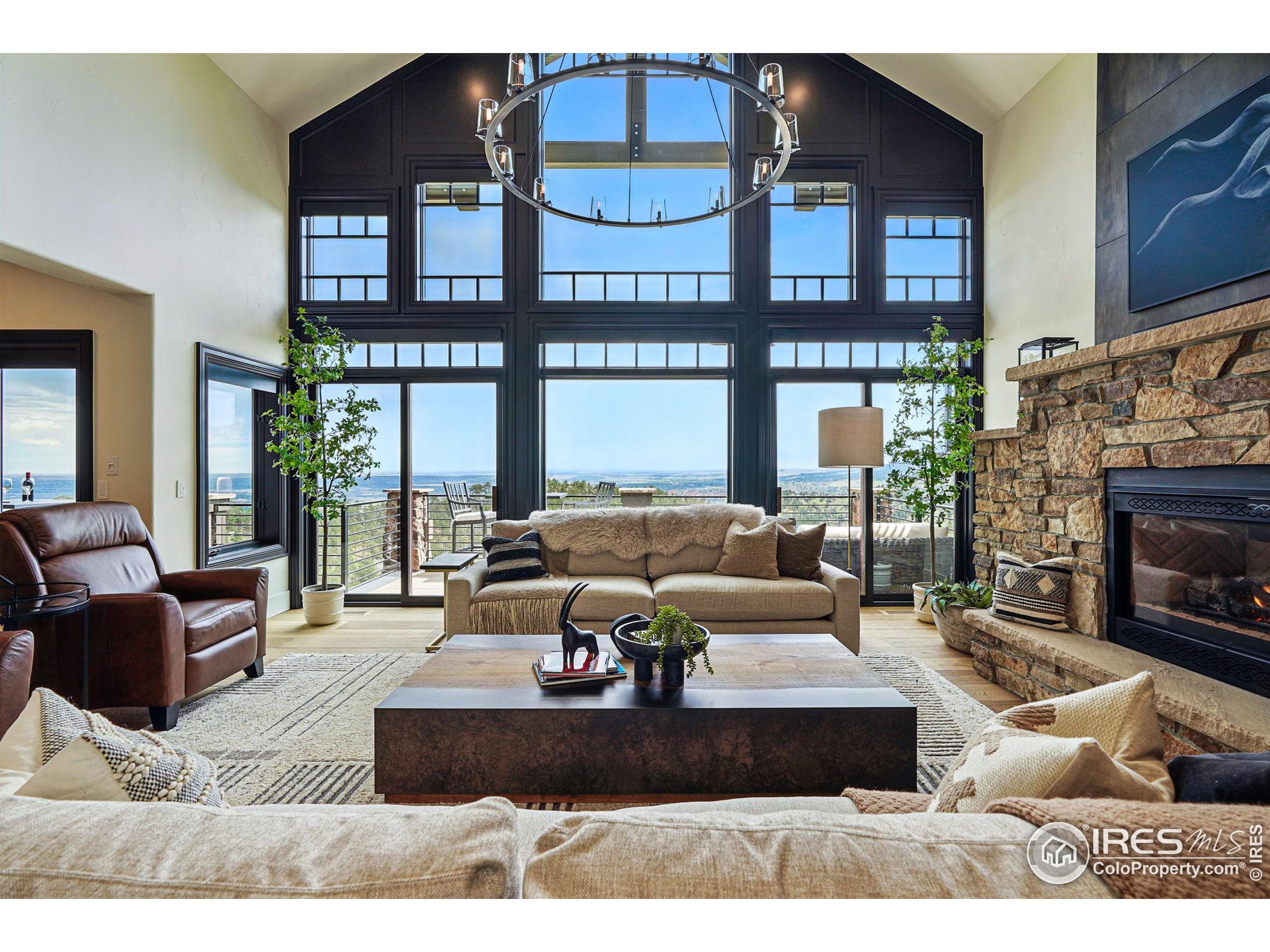 166 Valley View Way Boulder, CO 80304 - Photo 13 of 40 a living room with furniture fireplace and outdoor view