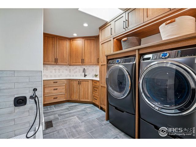 a view of a kitchen with a washer and dryer