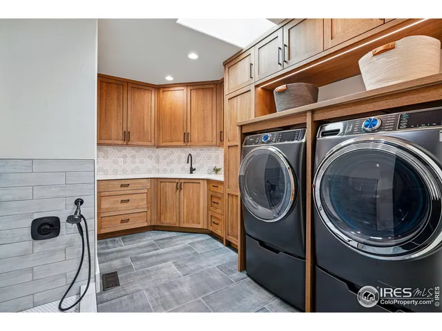 a view of a kitchen with a washer and dryer
