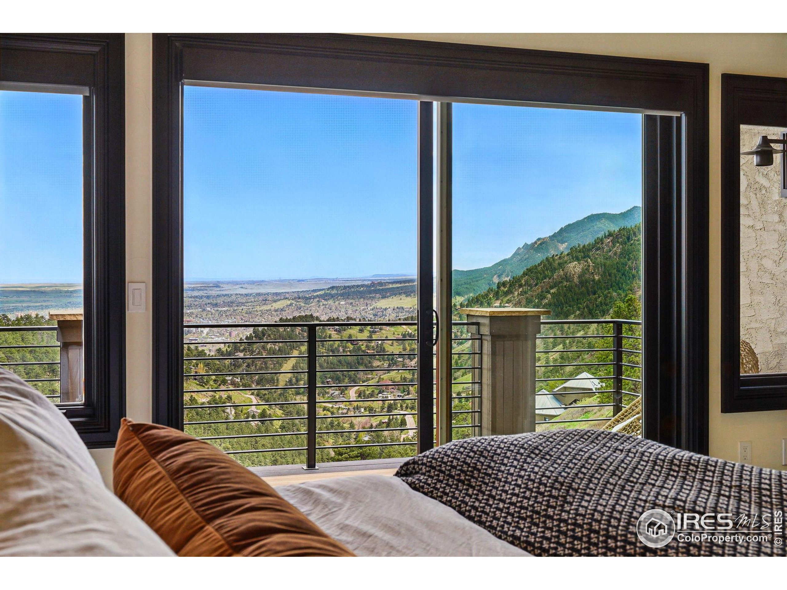 166 Valley View Way Boulder, CO 80304 - Photo 20 of 40 a bedroom with a large bed and a large window