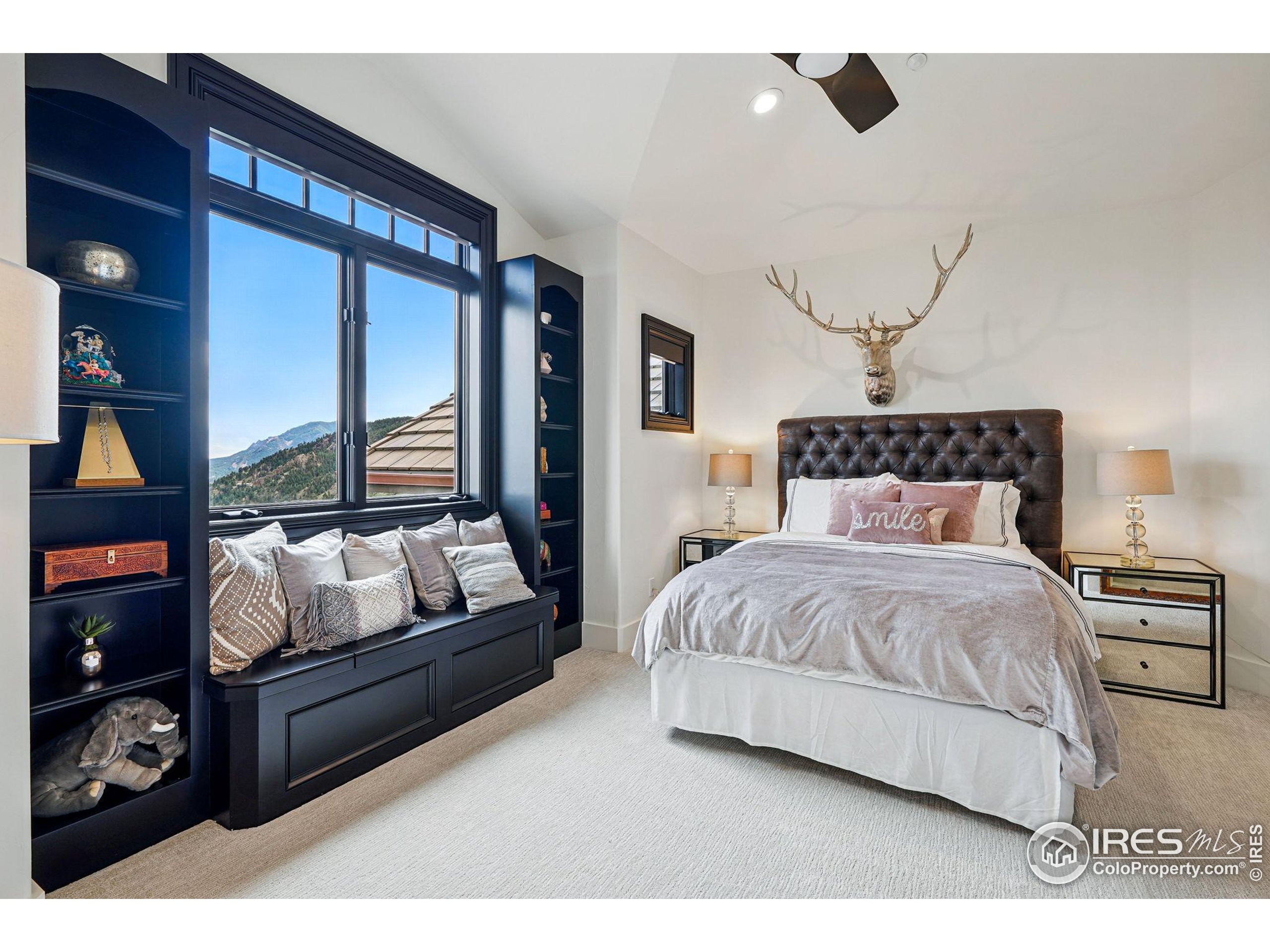 166 Valley View Way Boulder, CO 80304 - Photo 25 of 40 a bedroom with a bed window and couch