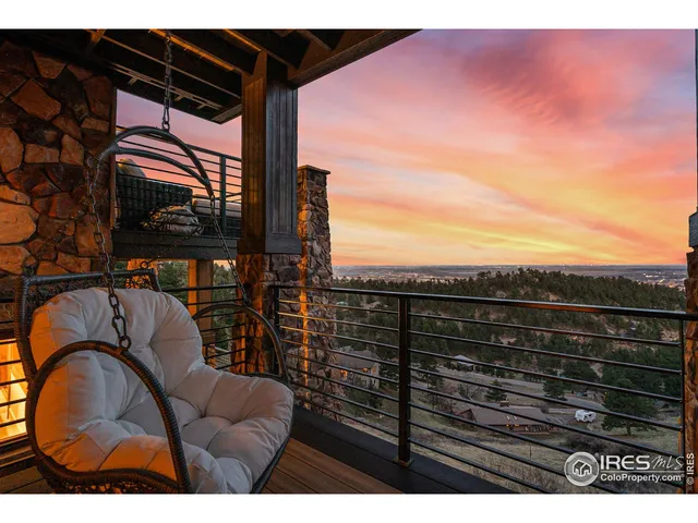a living room with furniture a flat screen tv and a kitchen