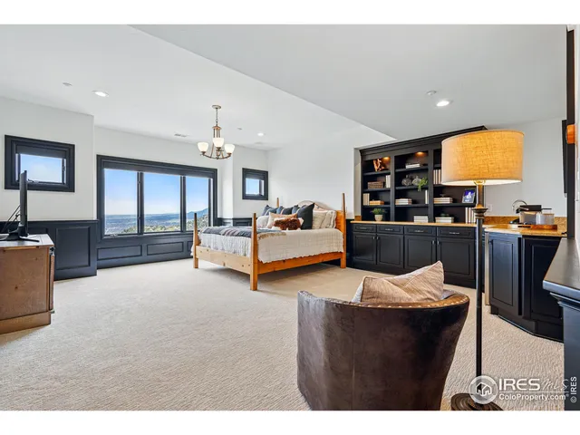 a living room with lots of furniture and kitchen view