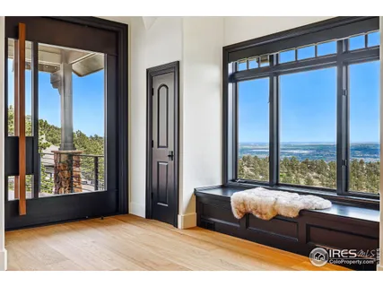a bedroom with furniture and large window