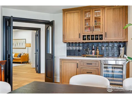 a bathroom with a sink a mirror and next to a window