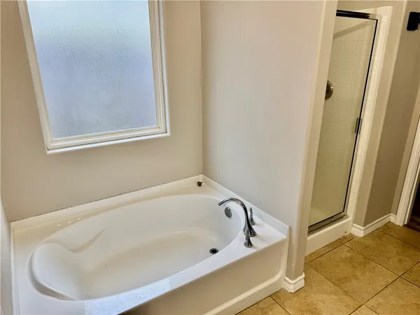 a white bath tub sitting in a bathroom