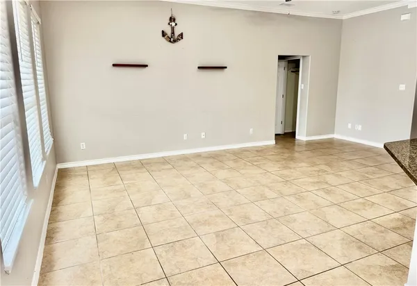 a view of an empty room and window