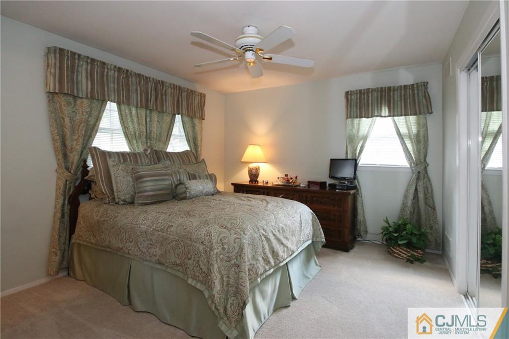 20 Corey Drive Ewing, NJ 08618 - Photo 12 of 25 a bedroom with a bed and a window