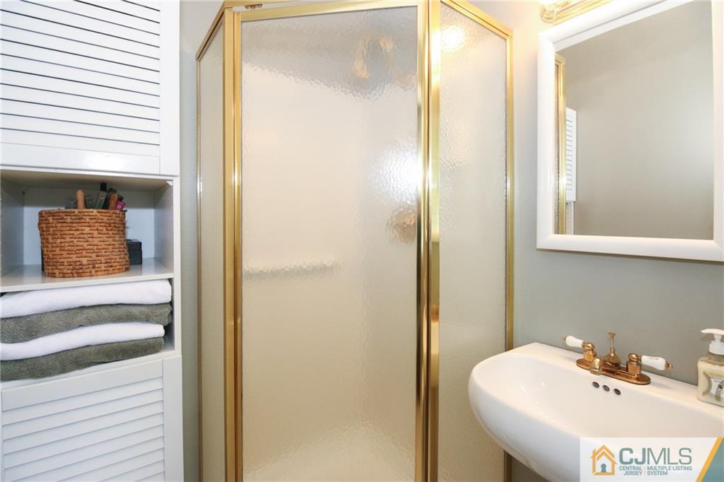 20 Corey Drive Ewing, NJ 08618 - Photo 14 of 25 a bathroom with a sink and a mirror