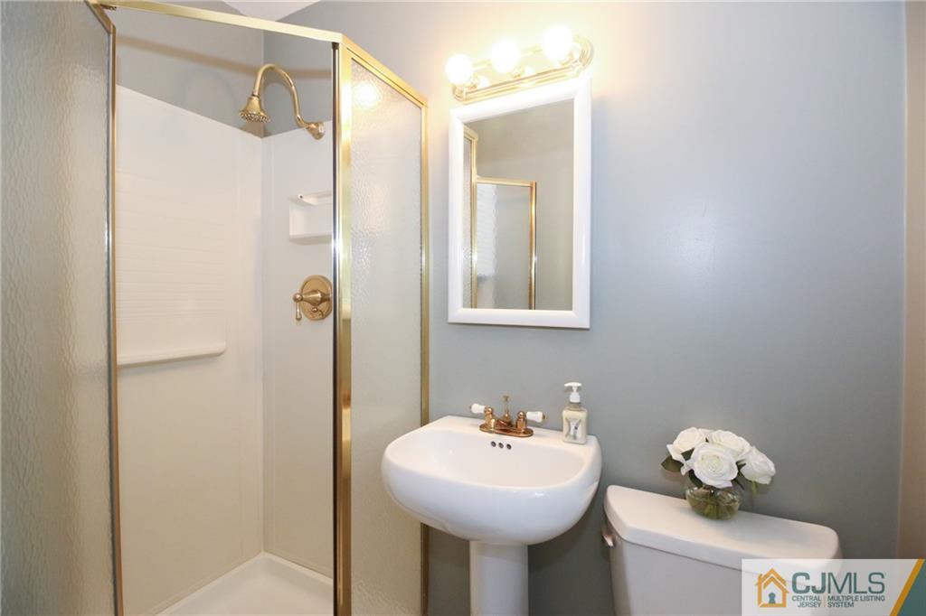 20 Corey Drive Ewing, NJ 08618 - Photo 15 of 25 a bathroom with a sink mirror and toilet