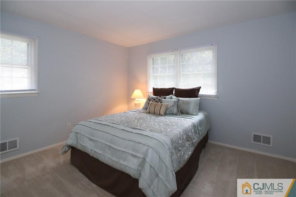 20 Corey Drive Ewing, NJ 08618 - Photo 17 of 25 a bedroom with a bed and window