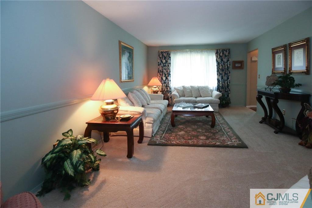 20 Corey Drive Ewing, NJ 08618 - Photo 3 of 25 a living room with furniture a rug and a window
