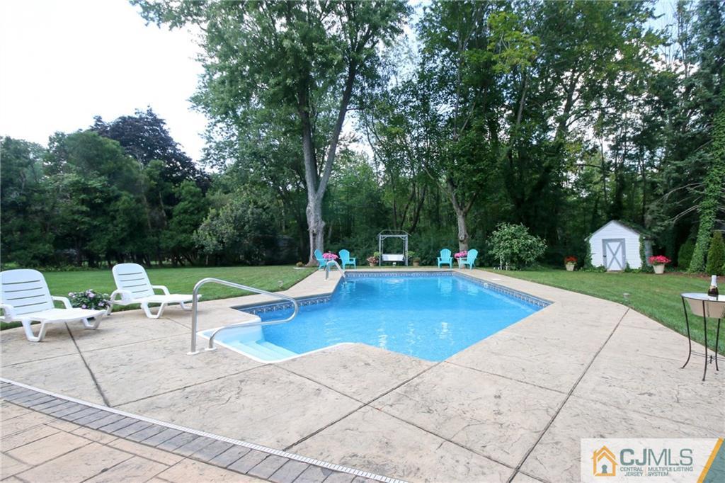 20 Corey Drive Ewing, NJ 08618 - Photo 25 of 25 a view of a swimming pool with lounge chairs in the patio
