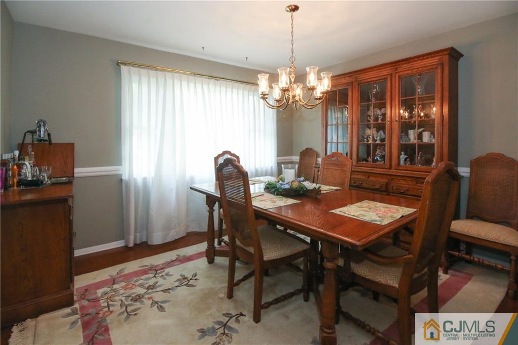 20 Corey Drive Ewing, NJ 08618 - Photo 5 of 25 a view of a dining room with furniture window and wooden floor