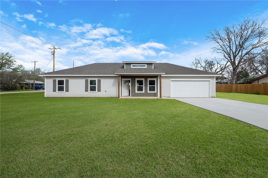 402 F Street Meridian, TX 76665 - Photo 2 of 32 a front view of a house with a garden