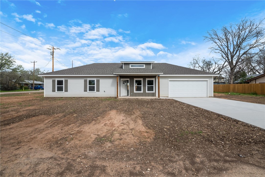 402 F Street Meridian, TX 76665 - Photo 27 of 32 a front view of a house with a garden