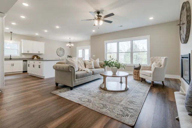 a living room with furniture and a large window
