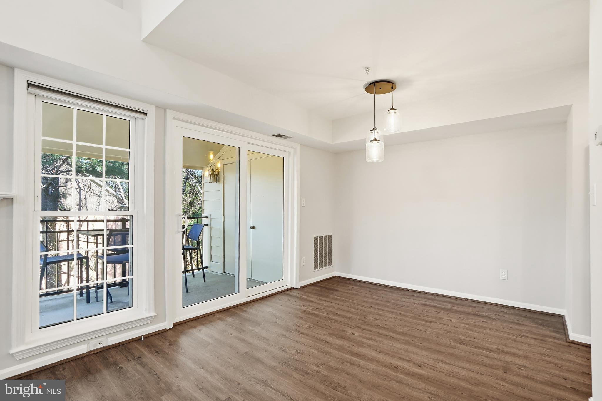 1365 Garden Wall Circle, Unit 703 Reston, VA 20194 - Photo 10 of 31 Dining room connects to the huge covered balcony