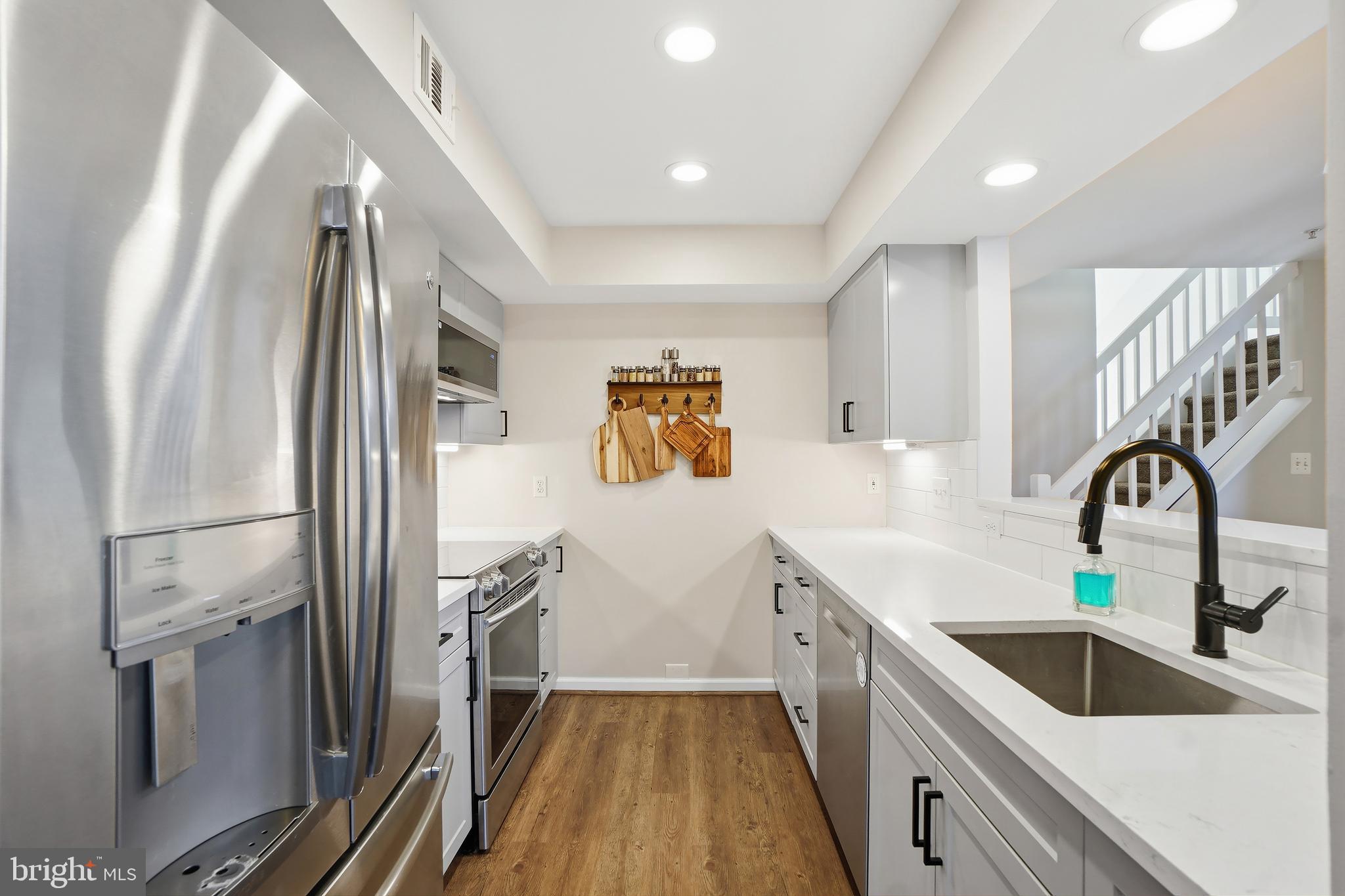 1365 Garden Wall Circle, Unit 703 Reston, VA 20194 - Photo 11 of 31 Reconfigured and renovated kitchen is a dream