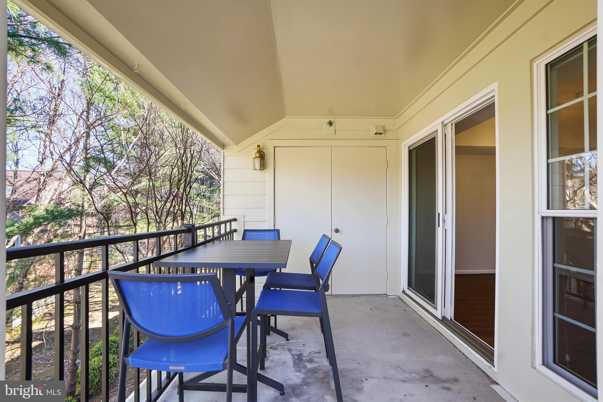 1365 Garden Wall Circle, Unit 703 Reston, VA 20194 - Photo 16 of 31 View of trees and a perfect spot all year round