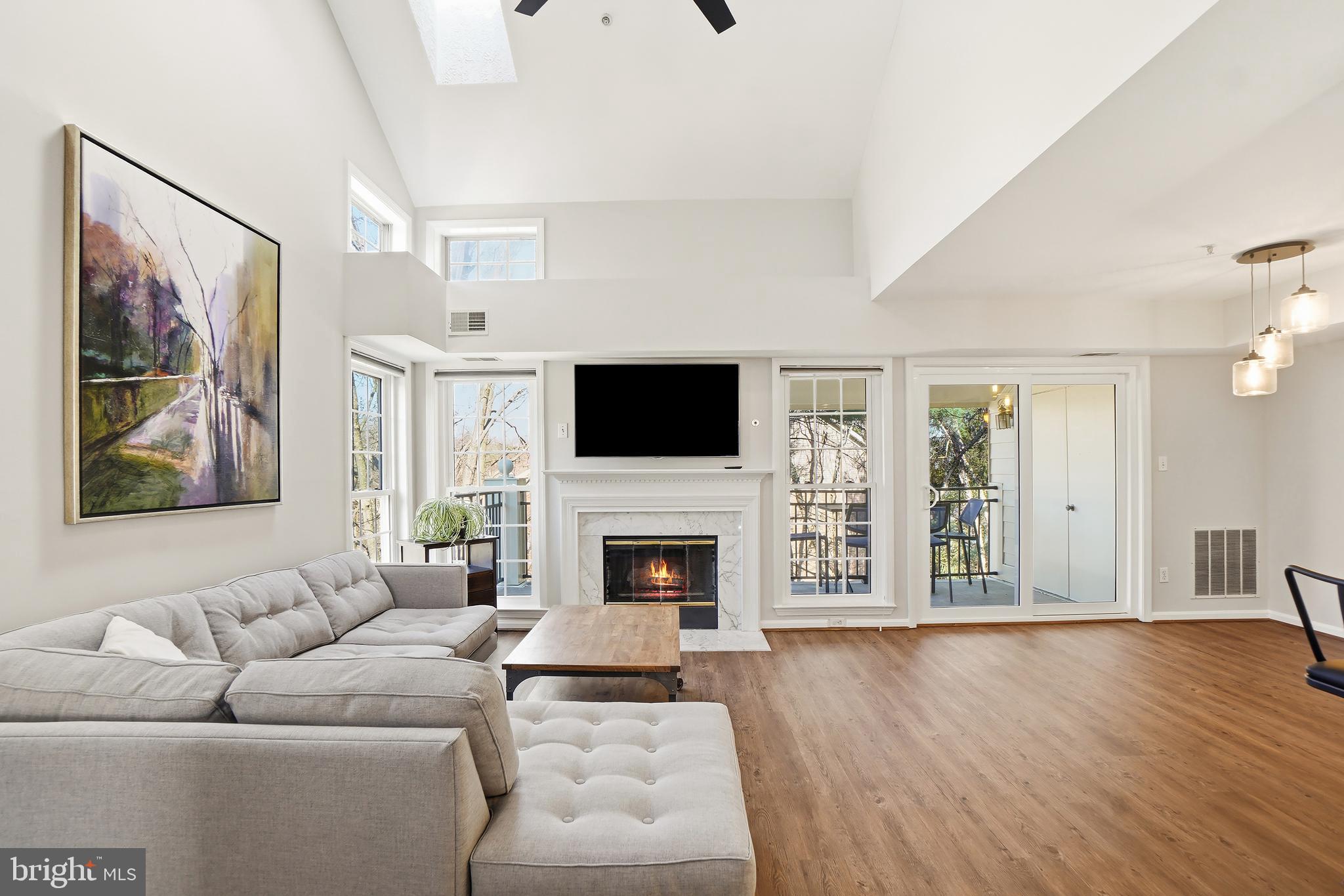 1365 Garden Wall Circle, Unit 703 Reston, VA 20194 - Photo 5 of 31 LVP flooring, vaulted ceiling, fireplace and CF